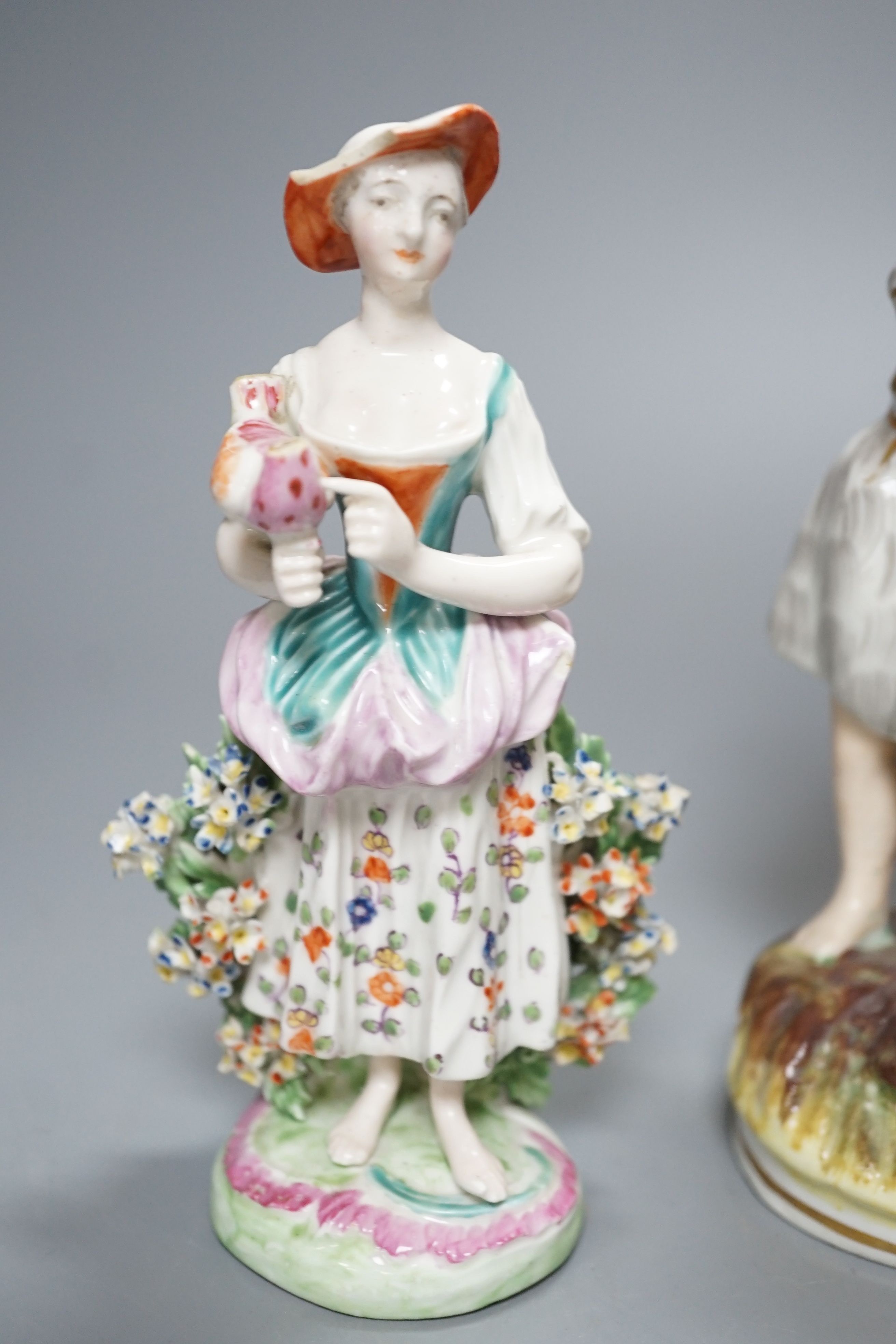 A Chelsea-Derby bocage figure, 16cm, 19th century pearlware figure of Cupid disguised and one other Staffordshire figure